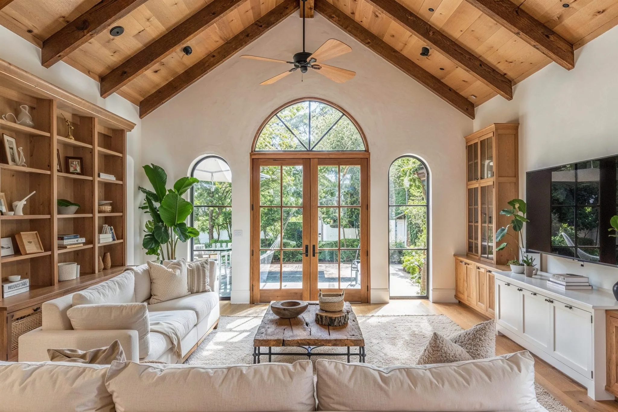 A bright residential living room with natural wood finishes